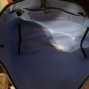 Black coach bag with blue stars; matching wallet